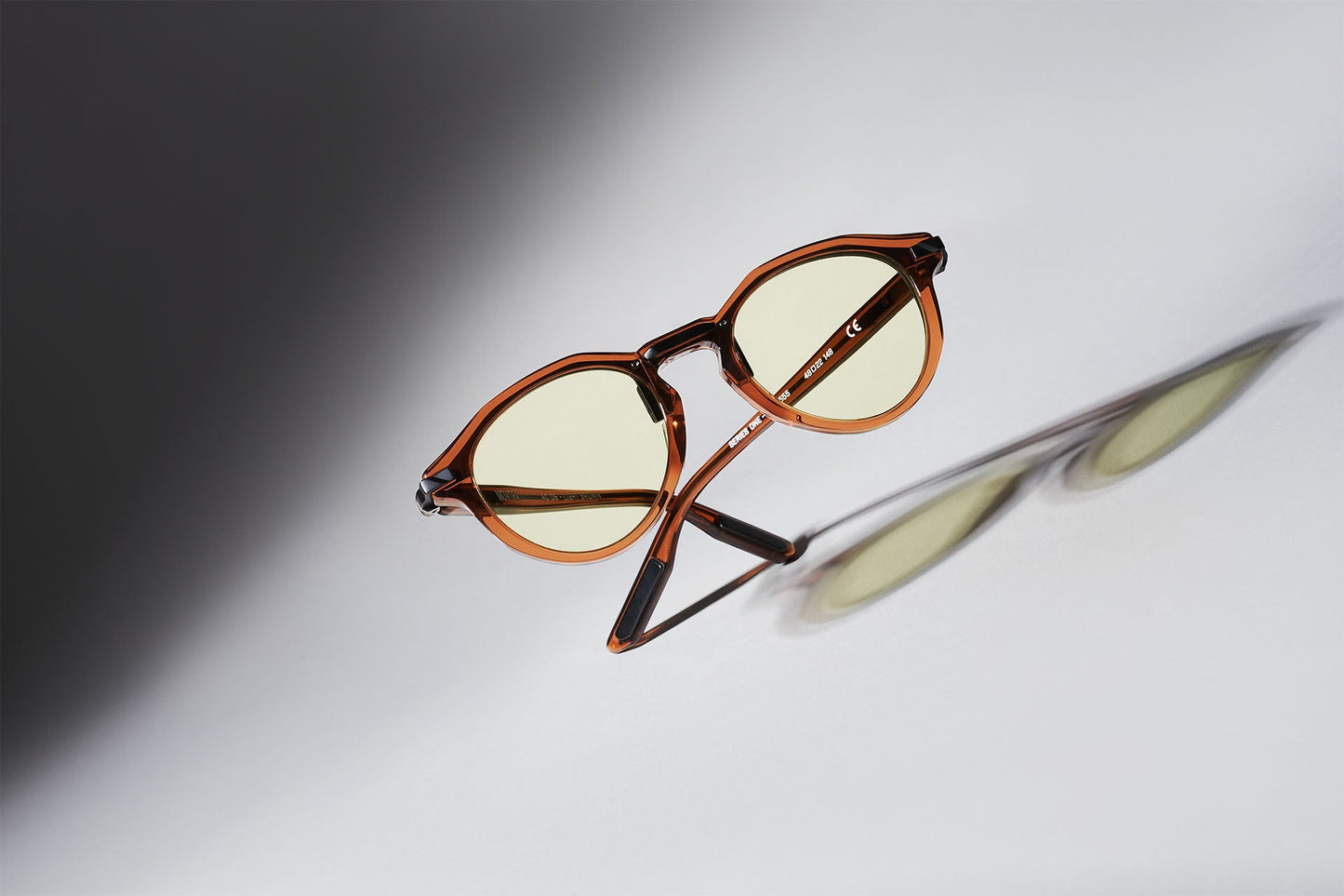 AC05 Light Brown with Light Green Lenses